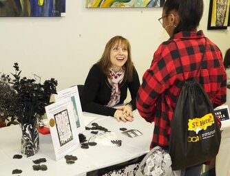 Yvonne Ventresca with a writer at Burlington YA Authorfest
